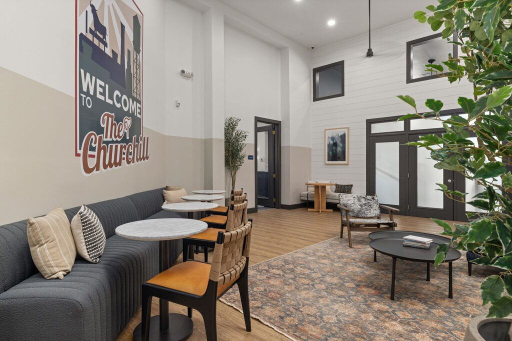 Clubhouse seating area with couches, lounge seating and tables with couches