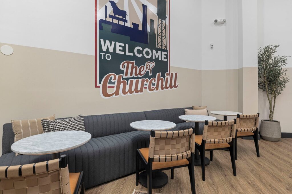 Clubhouse seating area with couches, tables and chairs