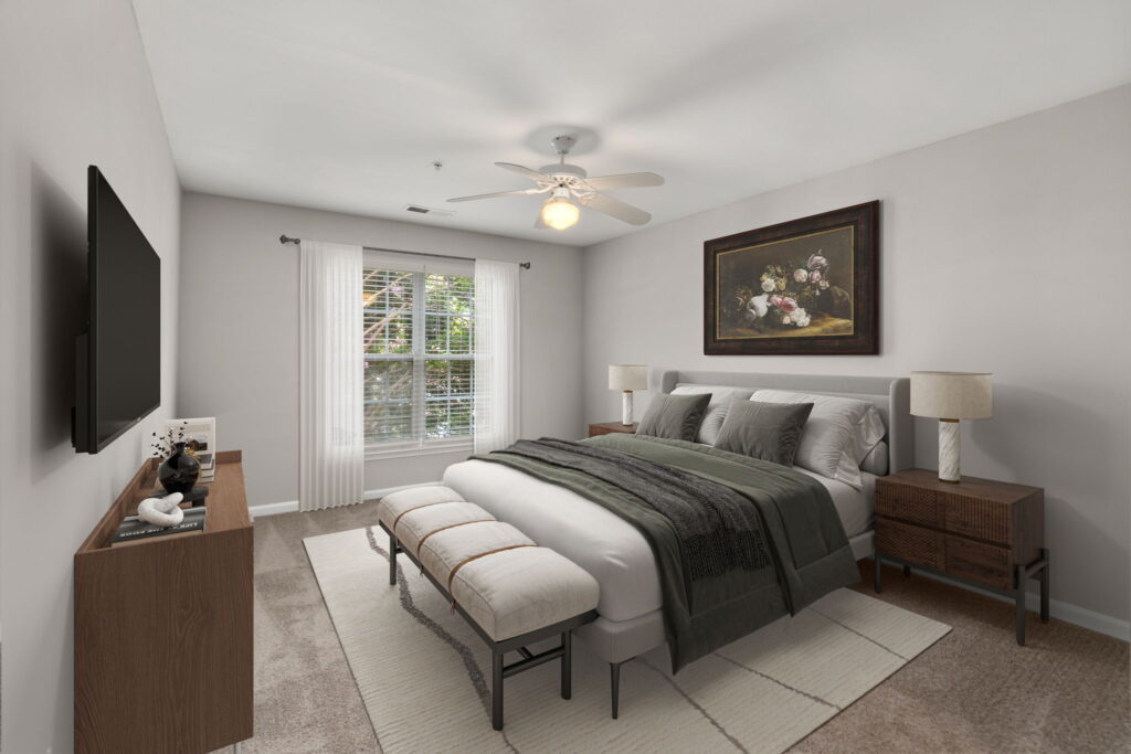 Carpeted bedroom with bed, nightstands, decor and large window